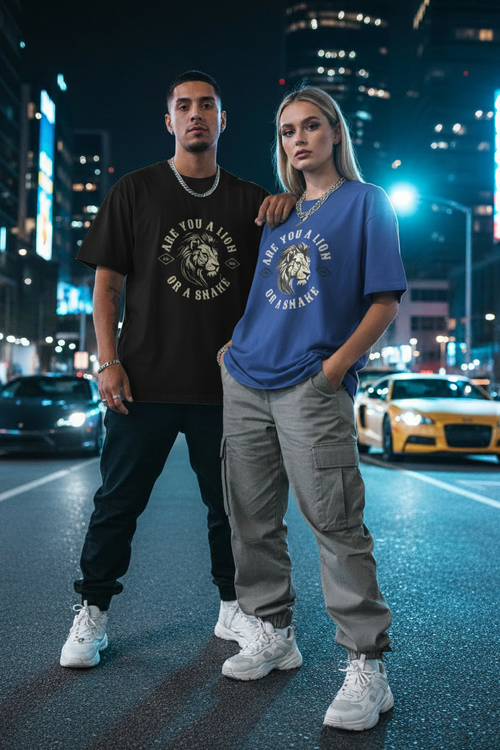 Hispanic male in black and white female in blue wearing Are You a Lion or a Snake Graphic Tee in city night setting