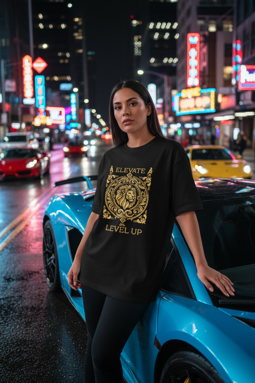 Hispanic female model wearing black Elevate Level Up Lion Graphic Tee in city night setting with sports cars