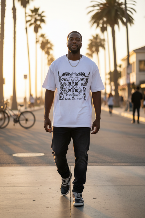 Black male model wearing white West Coast gothic graphic tee in Orange County California
