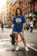 Hispanic female model wearing royal blue Sky Is The Limit t-shirt in NYC summer
