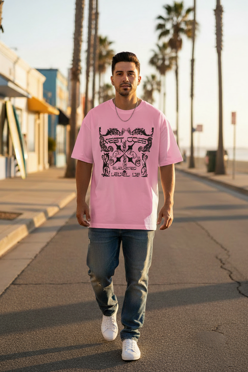 Hispanic male model wearing pink West Coast gothic graphic tee in Orange County California