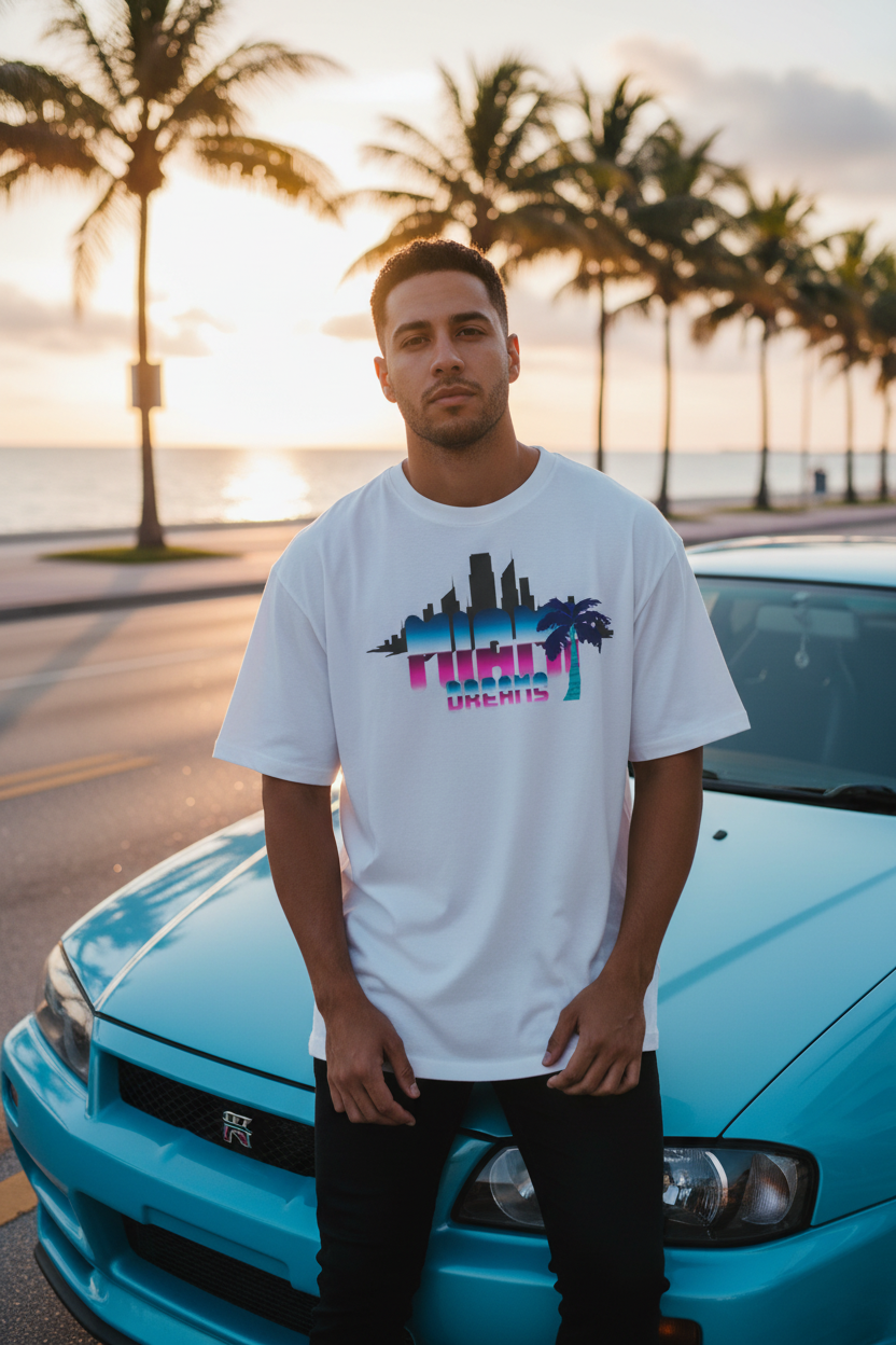 Hispanic male model wearing white Miami Dreams t-shirt next to R34 GTR on Miami beach street